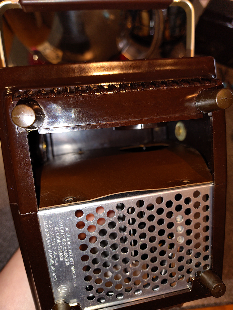 The inside of the projector, showing the paperboard covering protecting the mechanism
