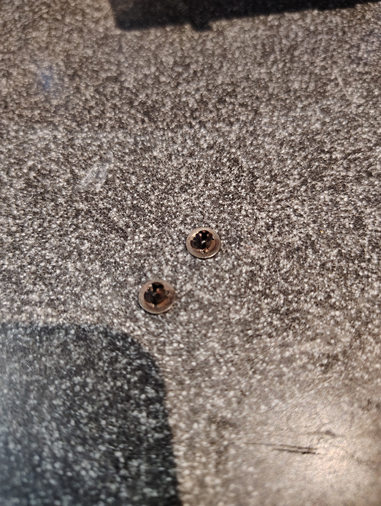 Studs? Brads? Rivets? I mean, you can undo them so they're not rivets, but that's the principle.